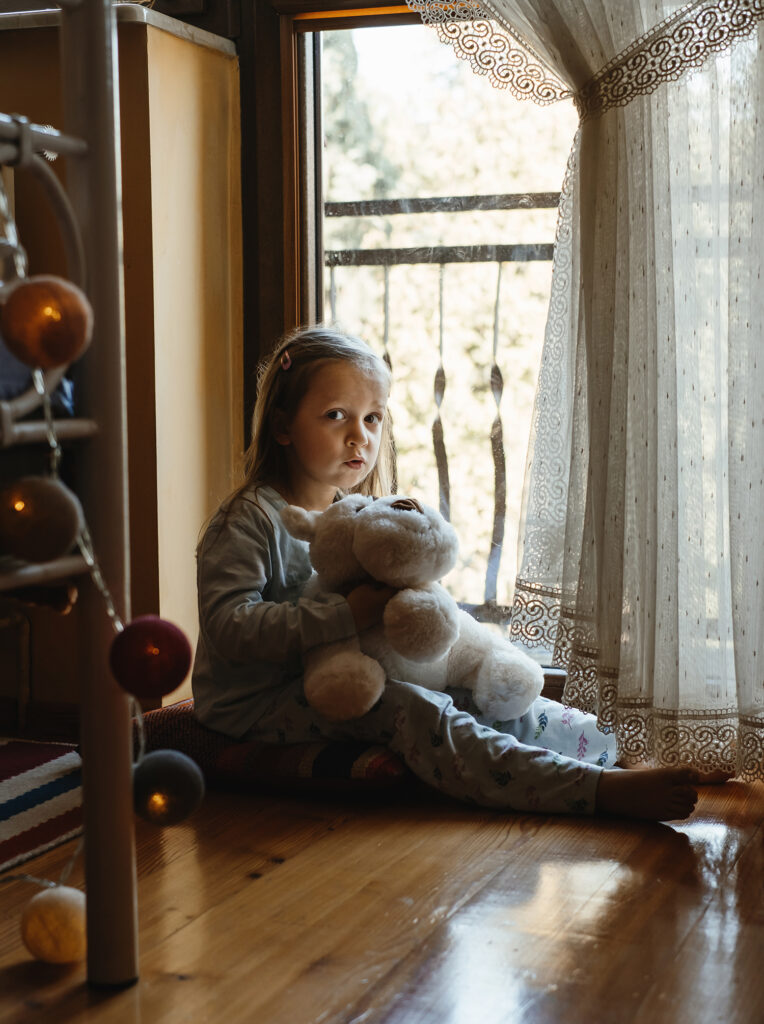 child by the window